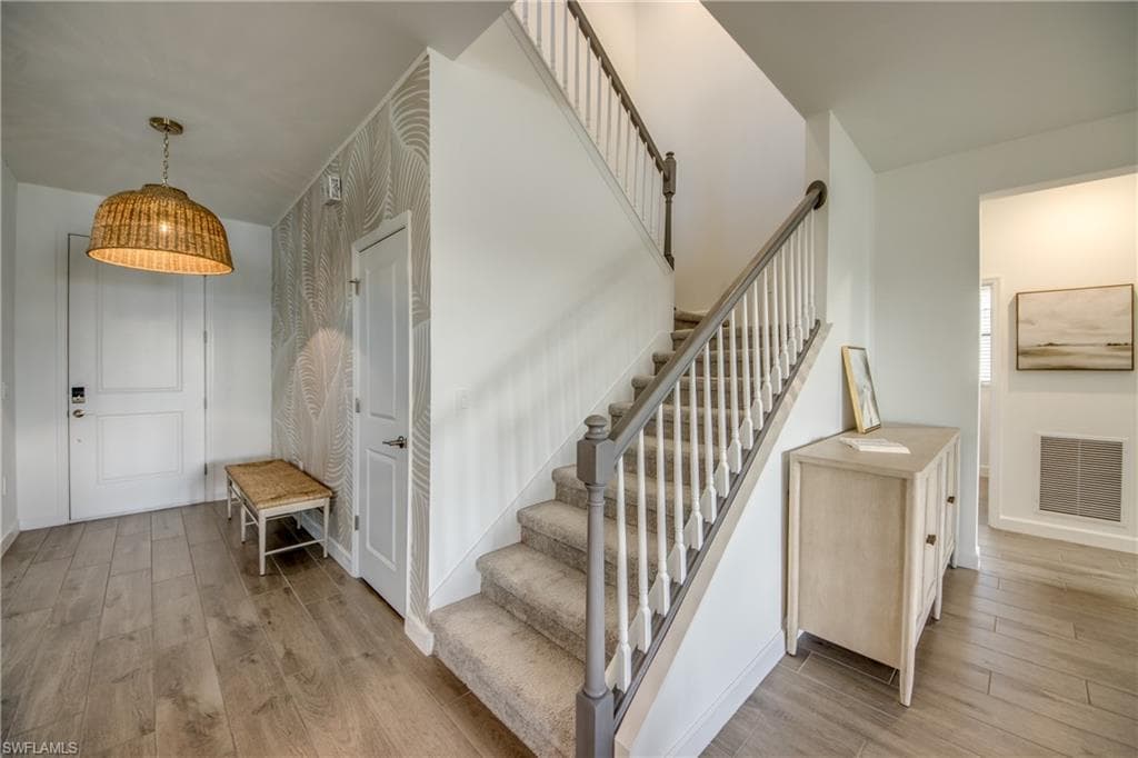 Staircase with wood finished floors
