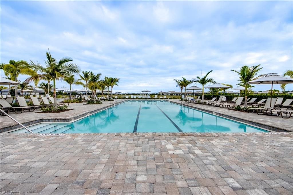 Community pool featuring a patio