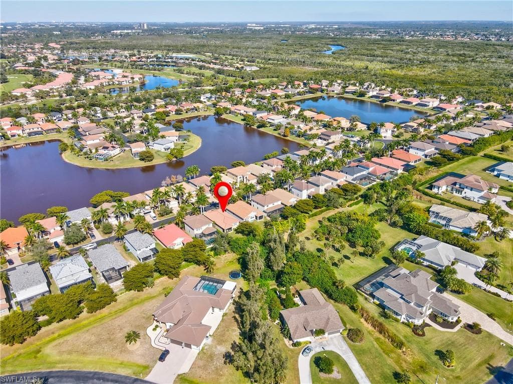 View of property location with nearby suburban area and a nearby body of water