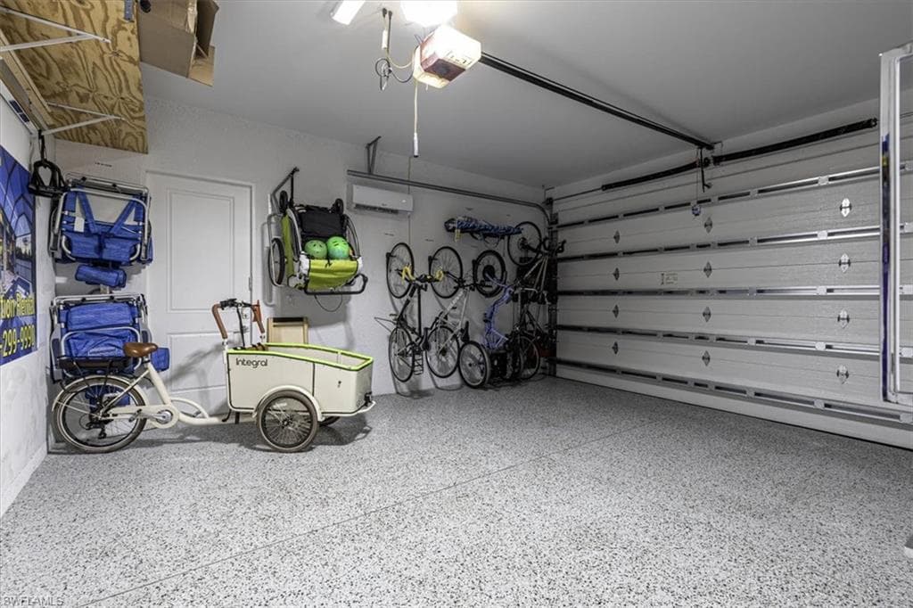 Garage with a garage door opener and an AC wall unit