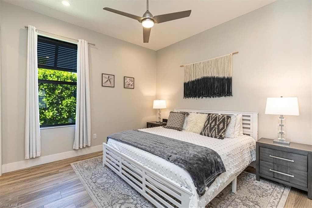 Bedroom featuring light wood-style floors and a ceiling fan