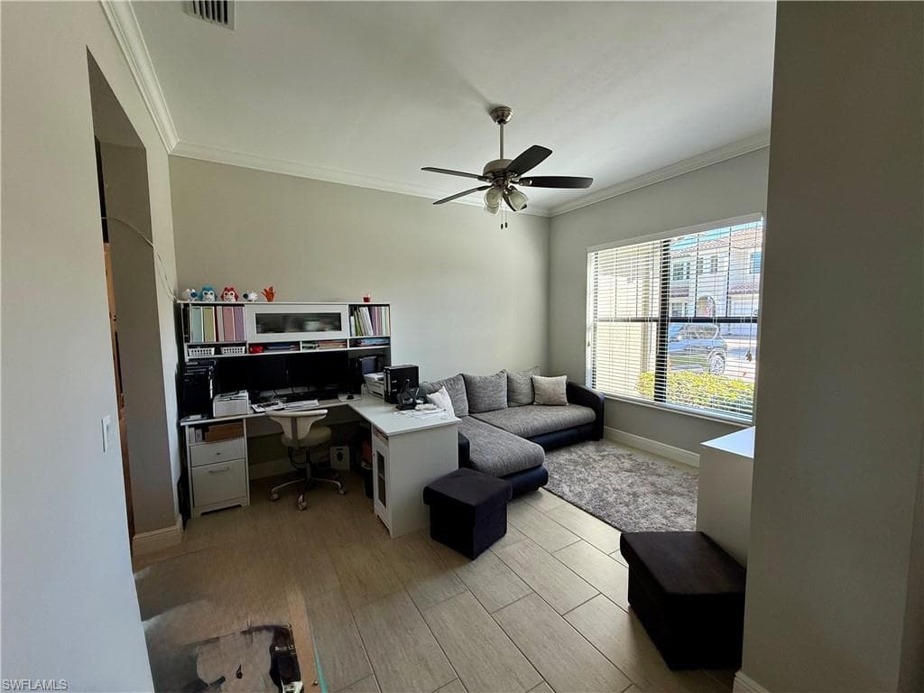 Office featuring wood tiled floors, ornamental molding, and a ceiling fan
