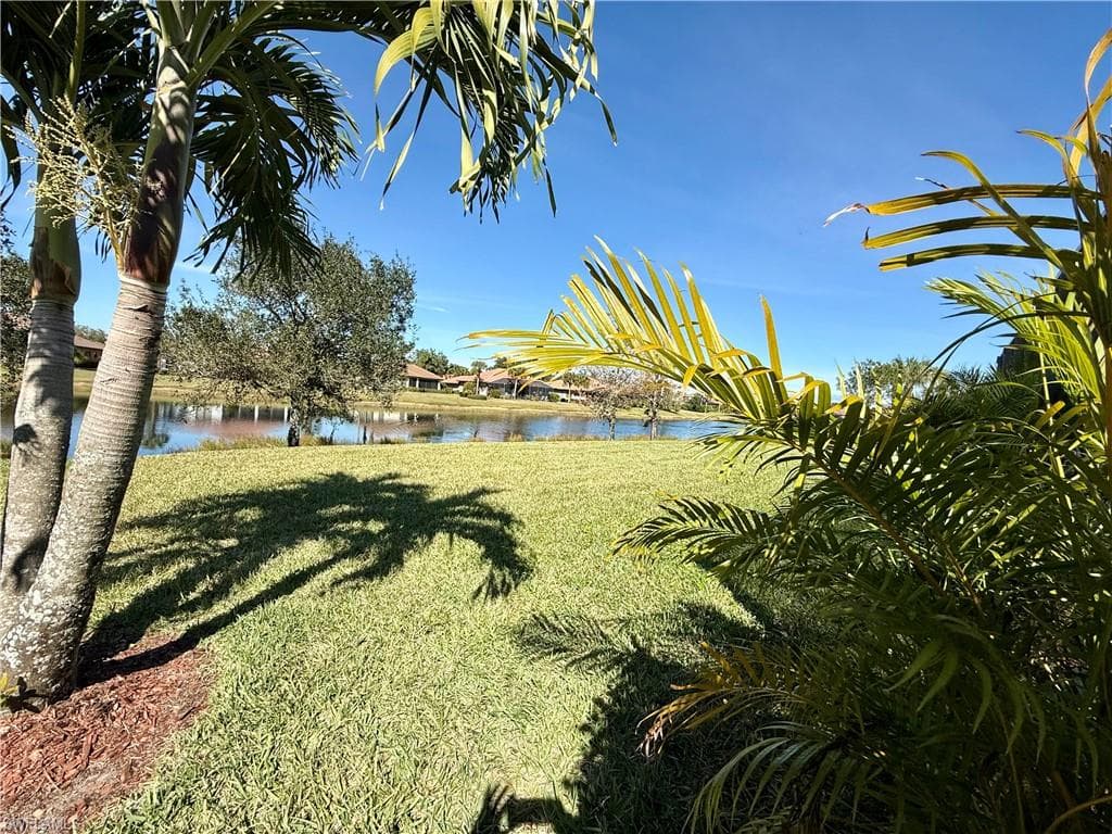 View of grassy yard featuring a water view