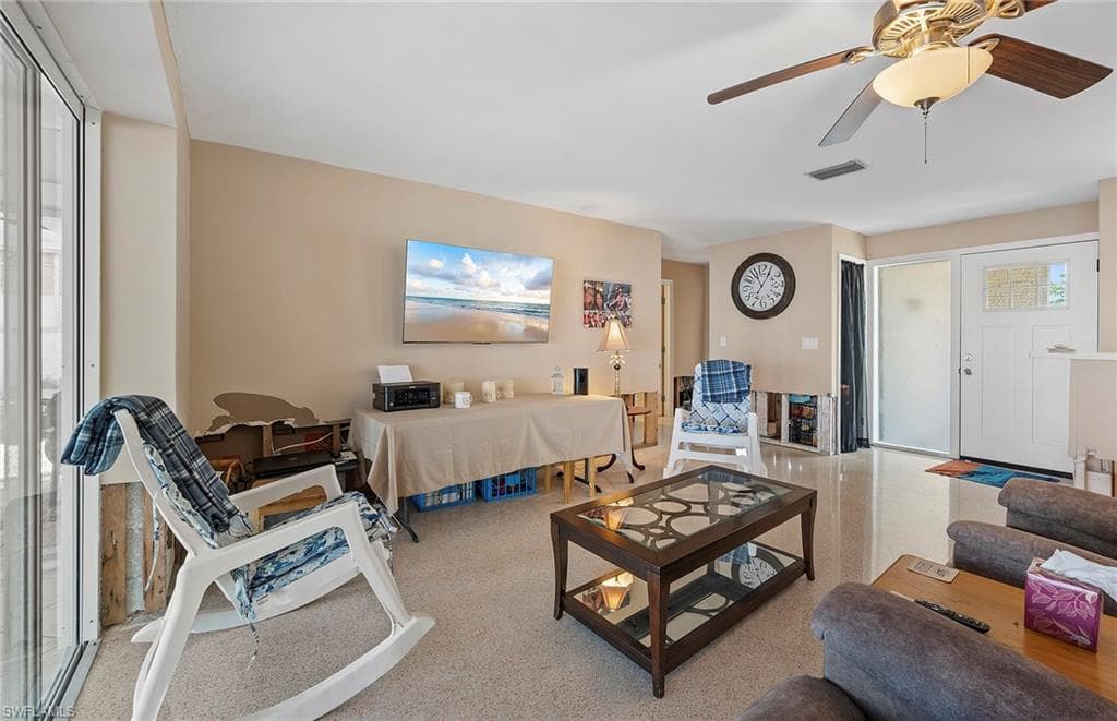 View of living room with terrazzo floors