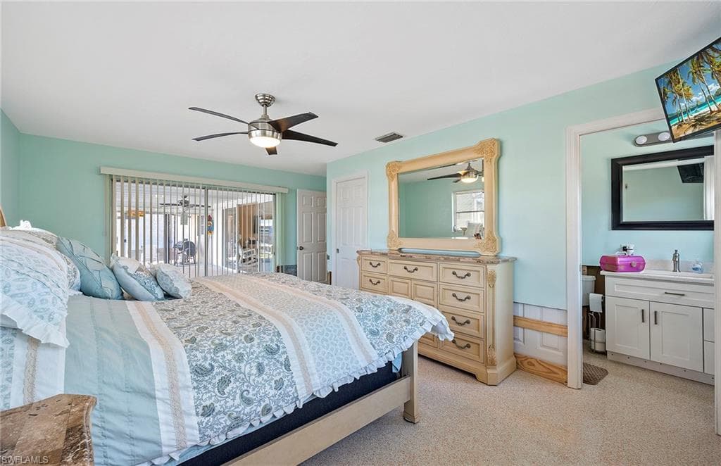Terrazzo floor bedroom featuring walk out to lanai access to pool