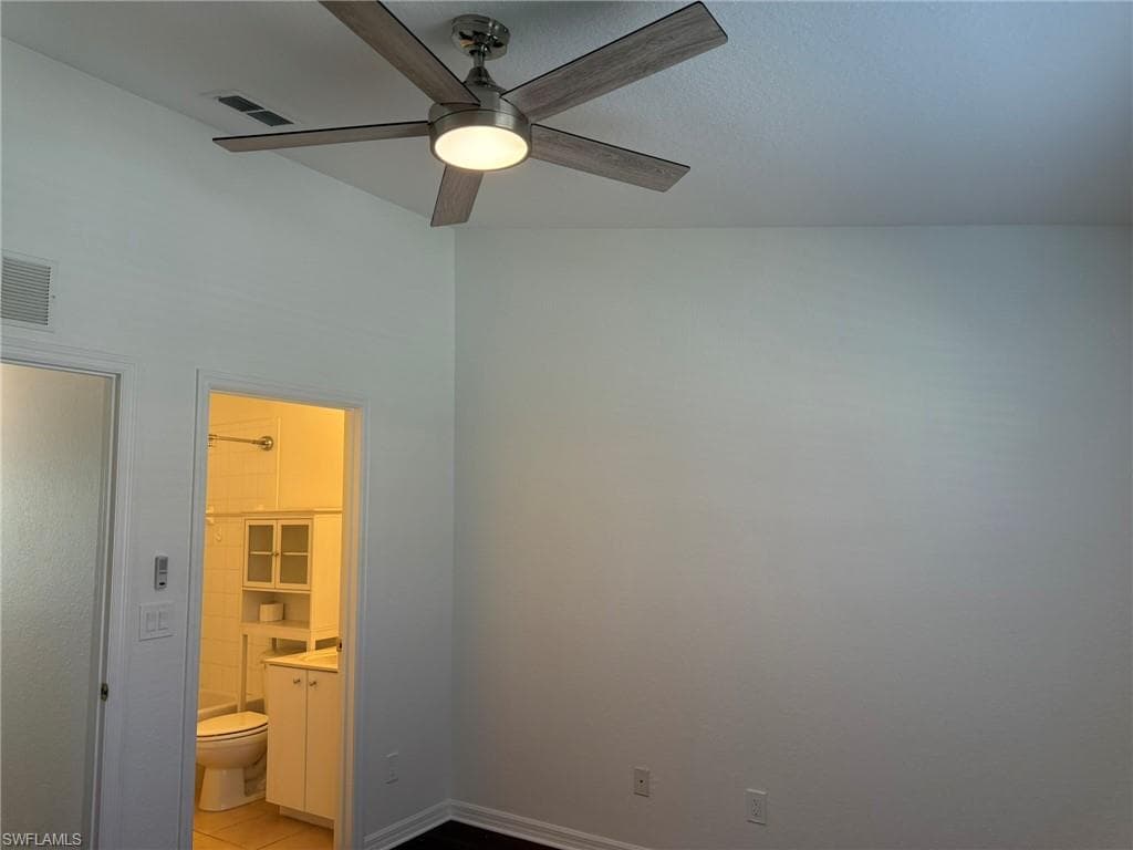 Bedroom 1 with Door to the Full Bath with Tub Shower Combination