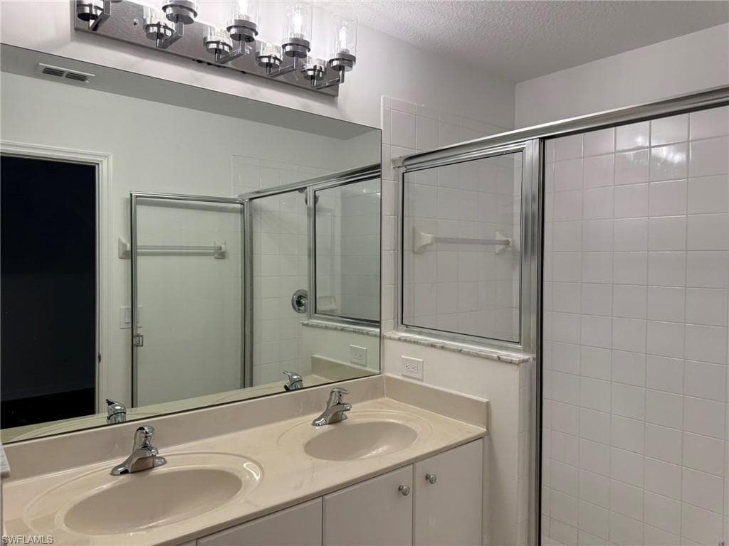 Bedroom 2 Full Bathroom with Dual Sinks and Shower