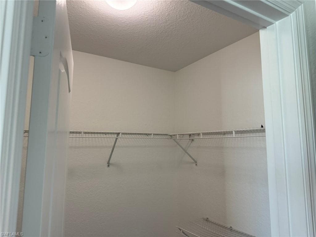 Bedroom 2 with 2 Large Walk In Sized Closets and 1 Linen Closet.