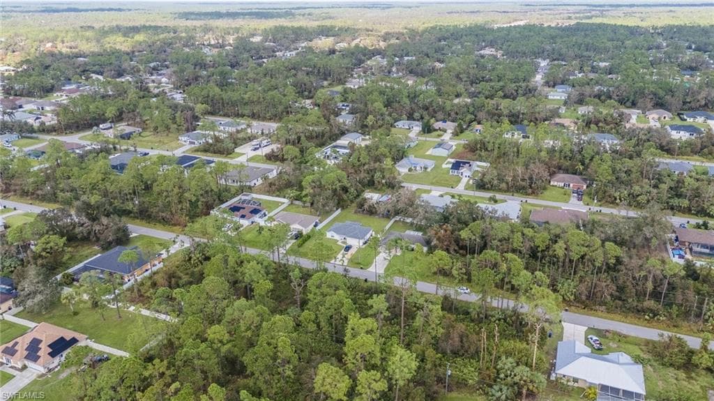 Aerial overview of property's location with nearby suburban area