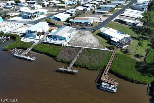 Aerial overview of property's location with a large body of water