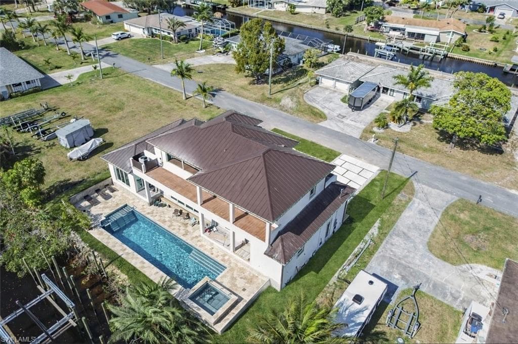 Aerial view of residential area featuring a large body of water
