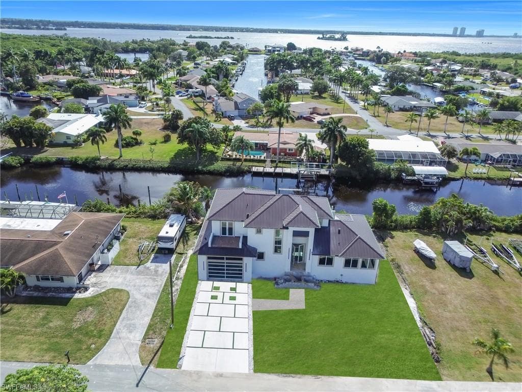 Aerial view of residential area with a nearby body of water