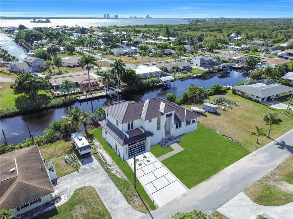 Aerial view of residential area with a large body of water