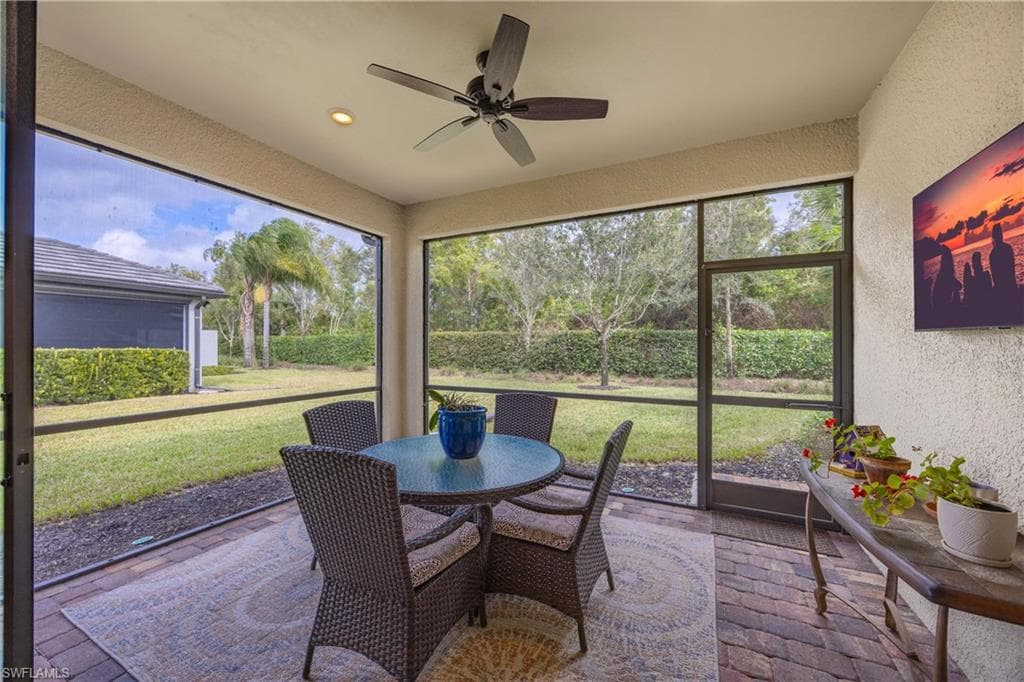 Large covered lanai featuring outdoor dining space