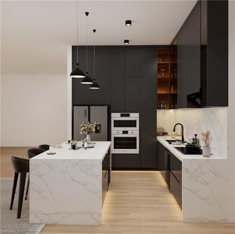 Kitchen with modern cabinets, light wood-style flooring, stainless steel refrigerator with ice dispenser, and light stone countertops (Rendered photo)