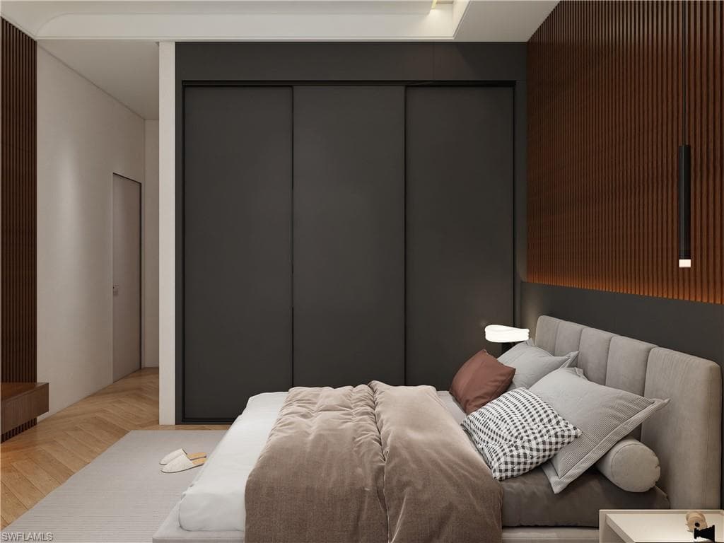 Bedroom featuring parquet flooring and a closet (Rendered photo)