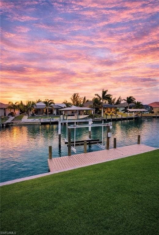Dock featuring a lawn, a water view, and a residential view (Rendered photo)