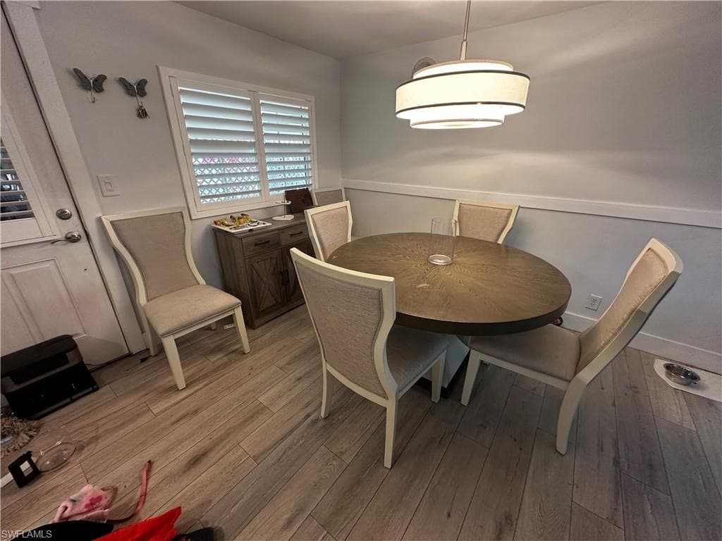 Dining space with light wood-type flooring