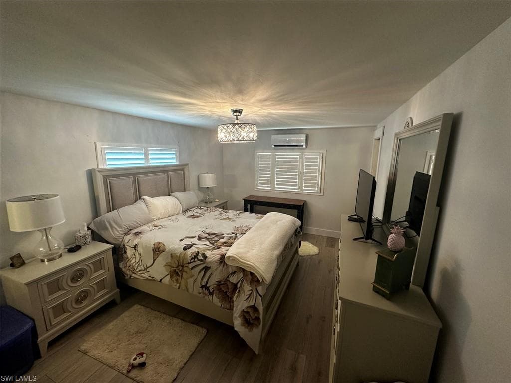 Bedroom with wood finished floors