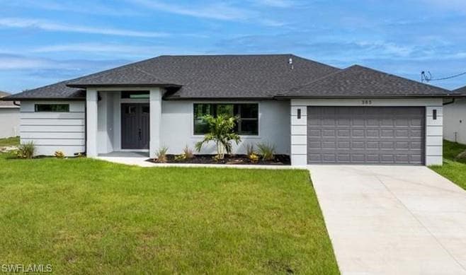 View of front of property featuring a front lawn, an attached garage, driveway, and stucco siding