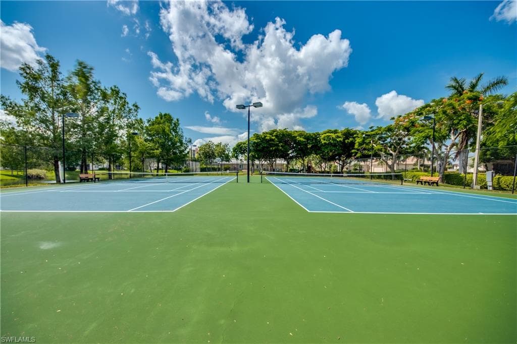 View of tennis court with community basketball court