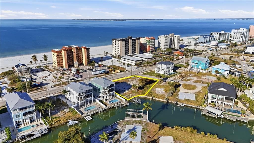 Aerial view of a large body of water and apartment complex - Virtually Edited Image