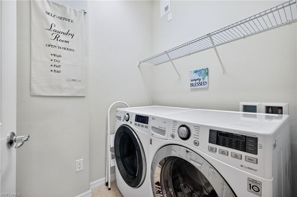 Large laundry room with storage space.