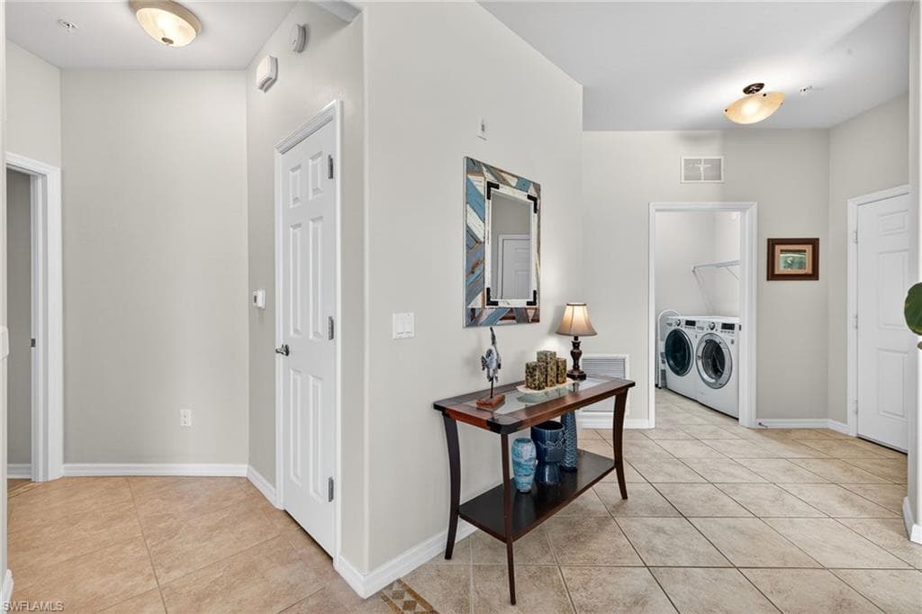 Split floor plan with hallway leading to private primary suite.