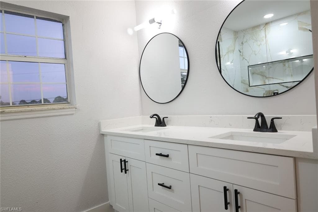 Bathroom featuring double vanity