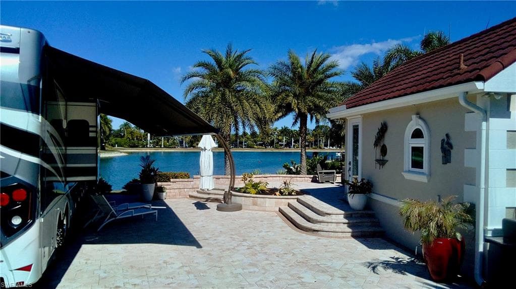 View of patio featuring a water view