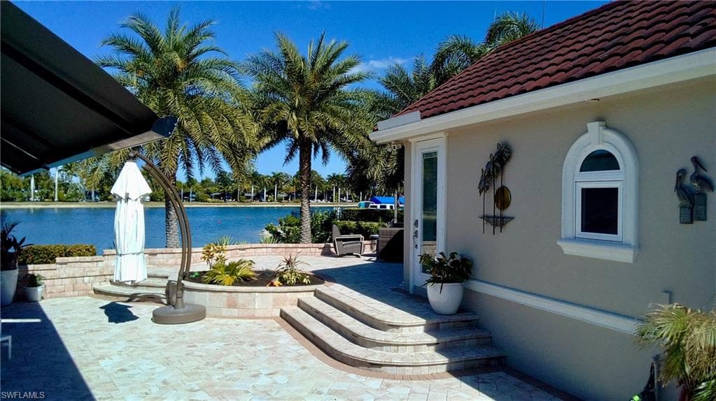 View of patio / terrace with a water view