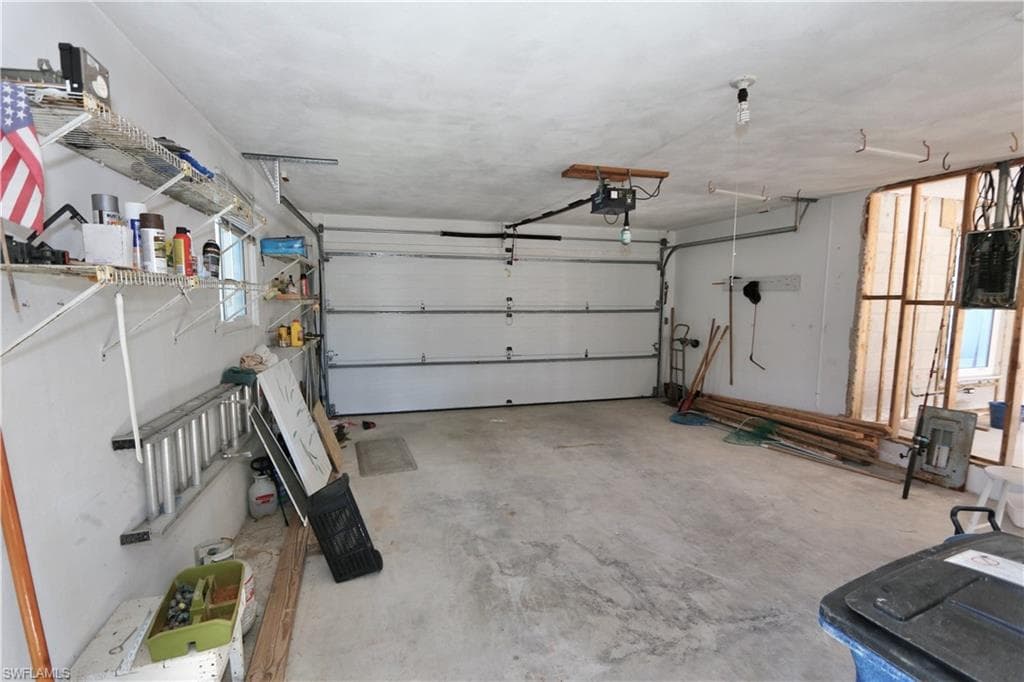 Garage featuring a garage door opener