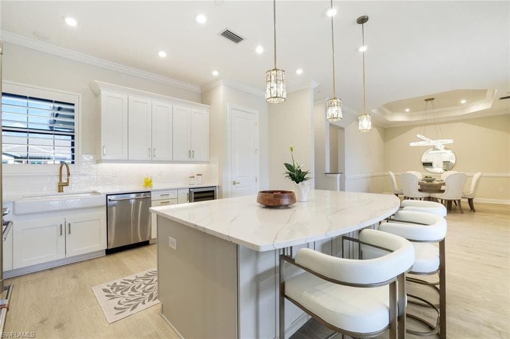 Stunning gourmet kitchen featuring an oversized quartz island, premium appliances, and custom finishes.