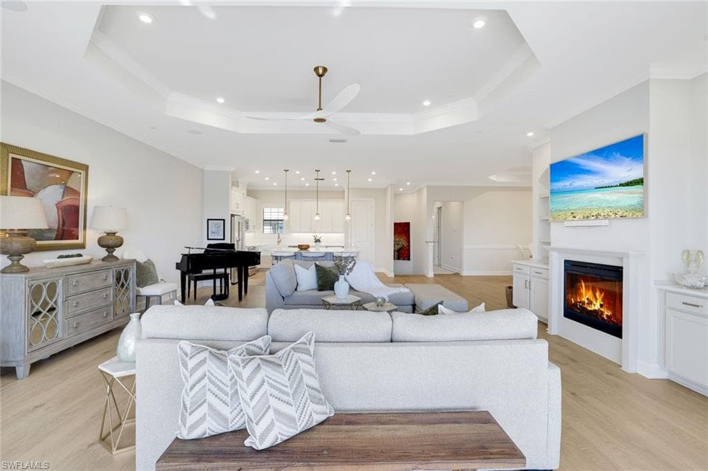 Elegant open-concept great room showcasing designer finishes, soaring ceilings, and seamless indoor-outdoor living.