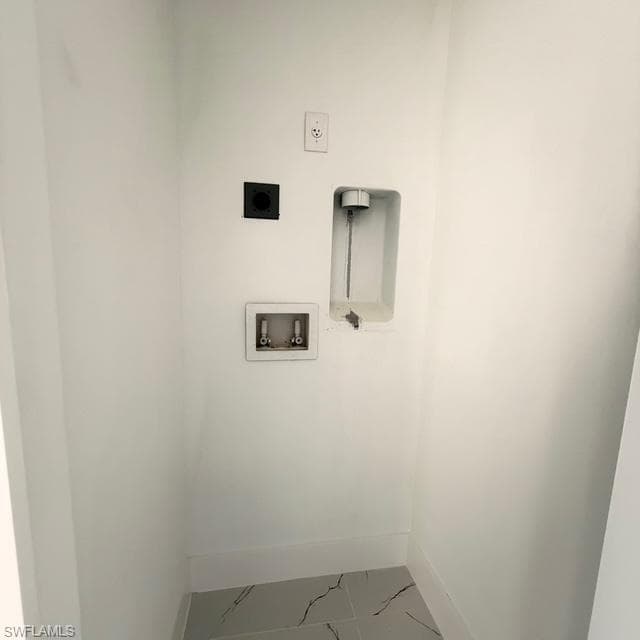 Laundry area with washer hookup and hookup for an electric dryer