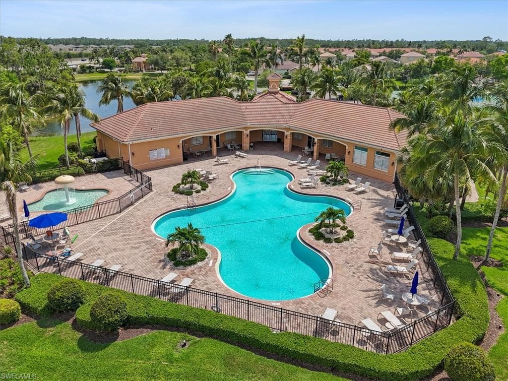 Community pool with a patio