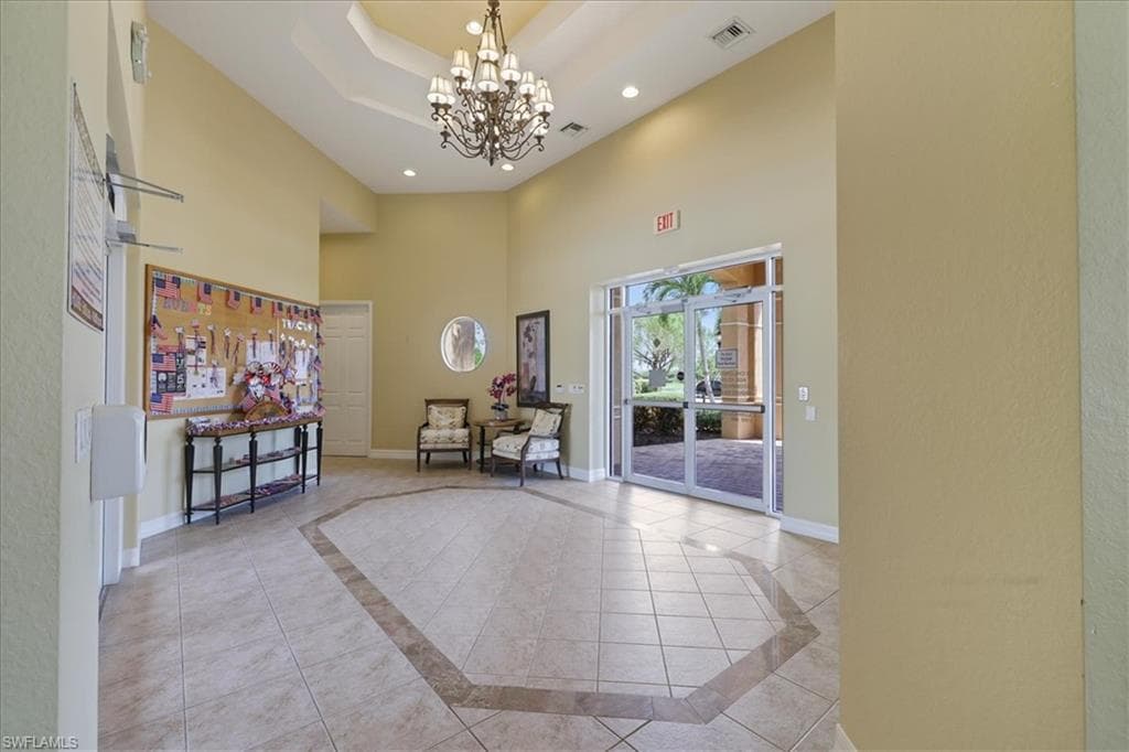 Community Building lobby with a high tray ceiling and recessed lighting