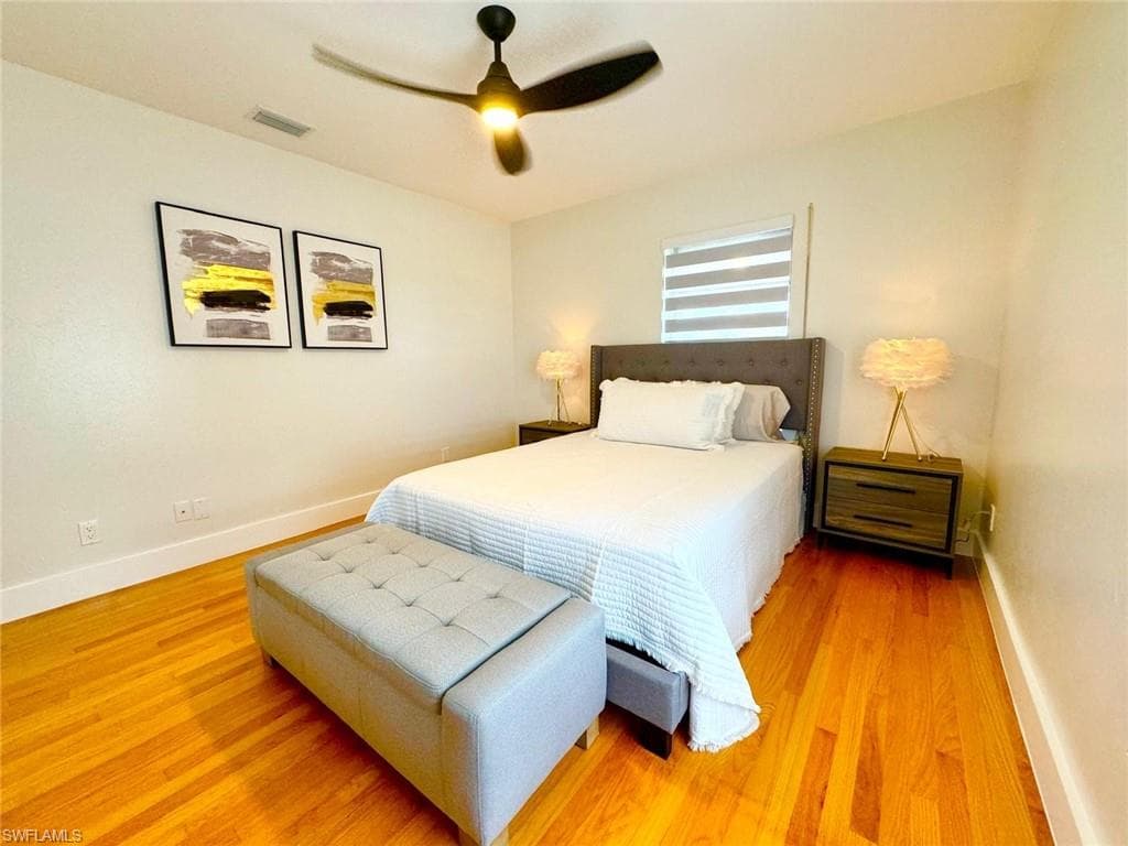 Bedroom featuring a ceiling fan and wood finished floors