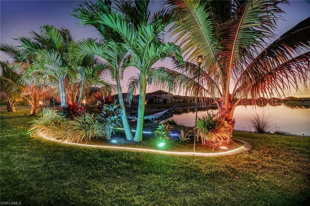 View of green lawn with a water view
