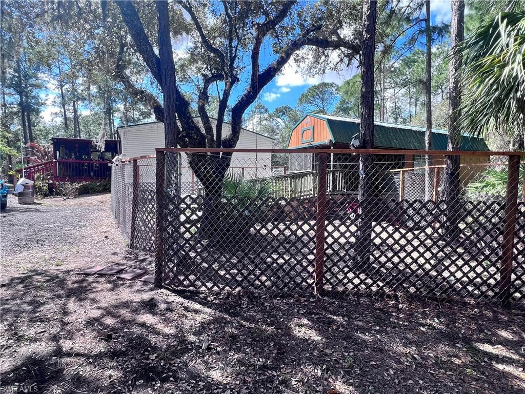 Gate featuring an outbuilding
