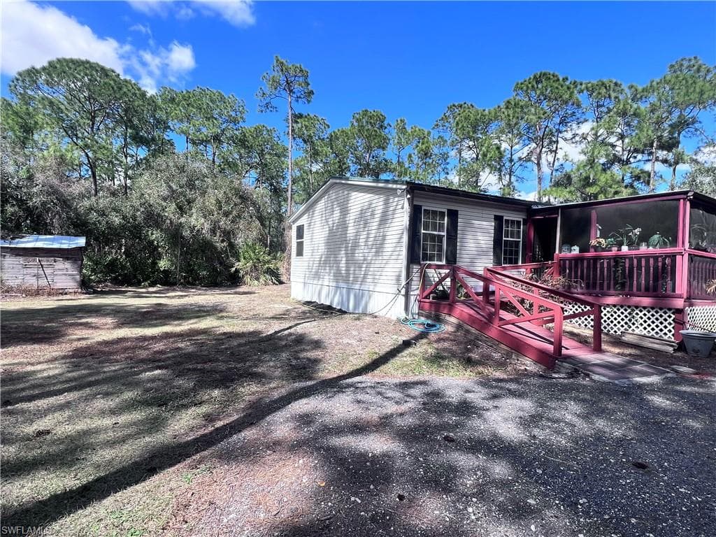 Manufactured / mobile home featuring a wooden deck