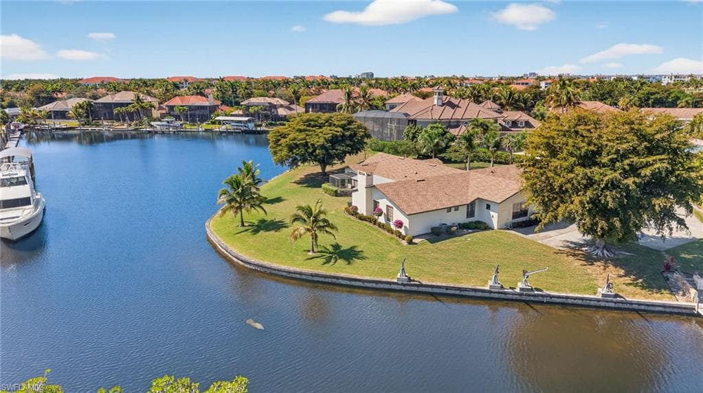 Aerial perspective of suburban area with a large body of water