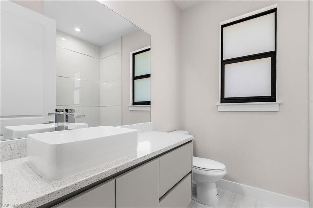 Bathroom with vanity and toilet