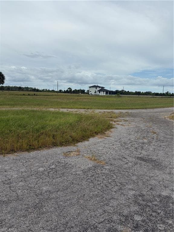 View of asphalt road with a view of countryside