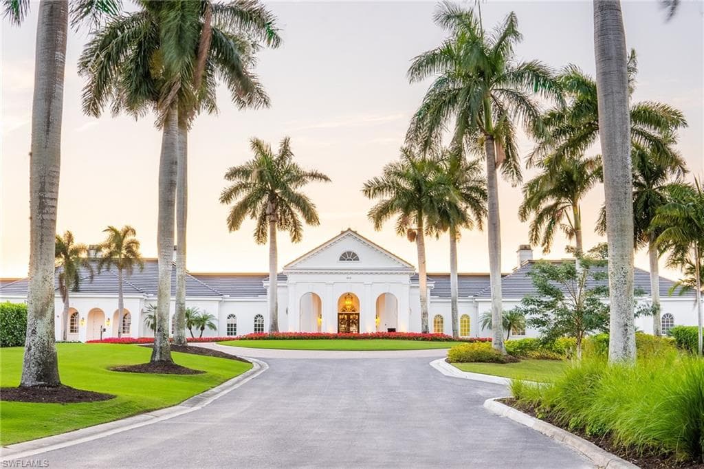 View of property at dusk