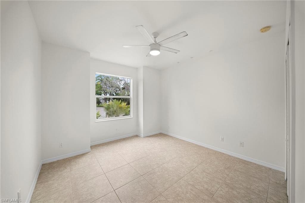 Neutral-toned tile flooring throughout