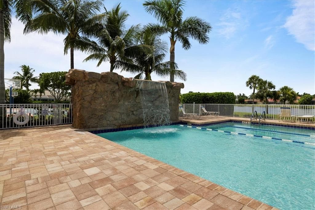 Community pool featuring a patio area