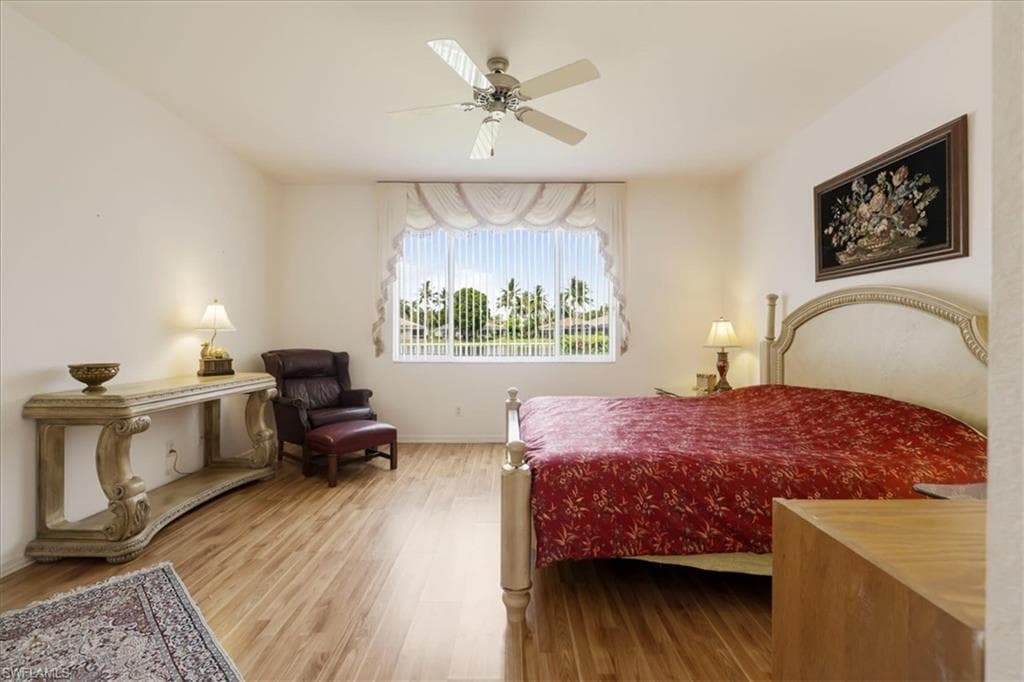 Bedroom featuring wood finished floors and a ceiling fan
