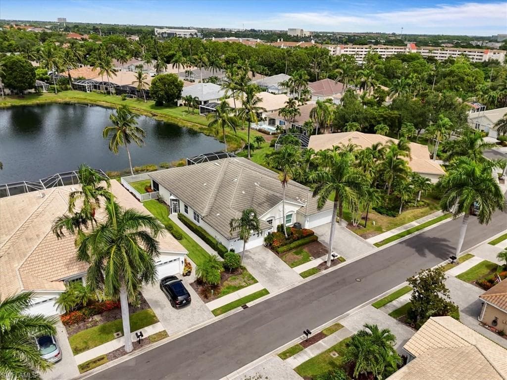 Aerial perspective of suburban area with a nearby body of water