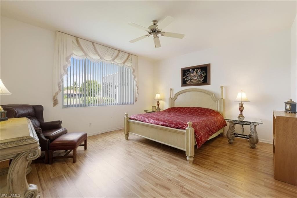 Bedroom featuring light wood-style flooring and a ceiling fan